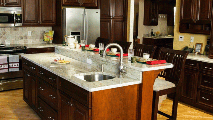 grey granite countertops with brown cabinets