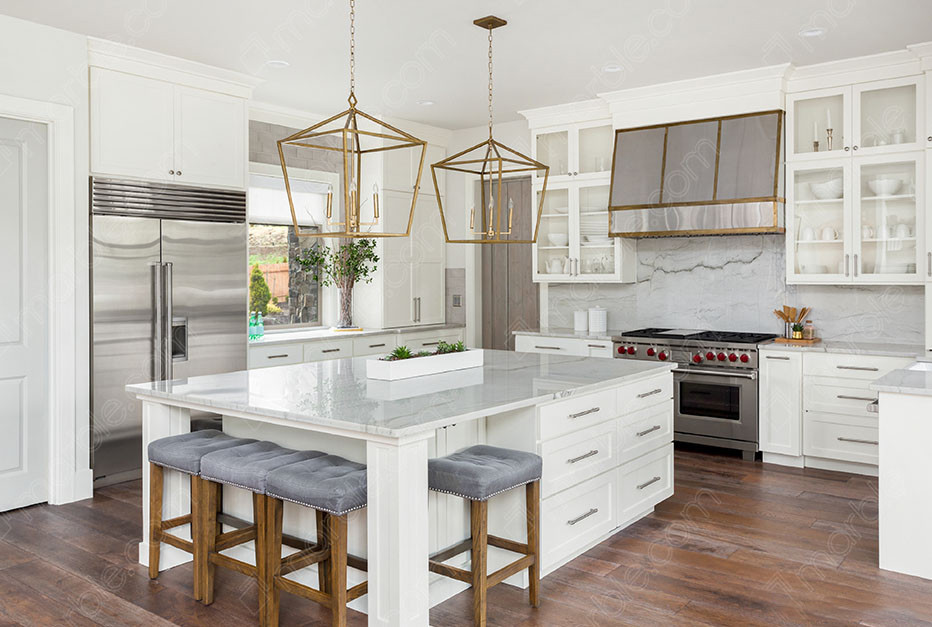 White marble kitchen counter top with a stove in a modern home