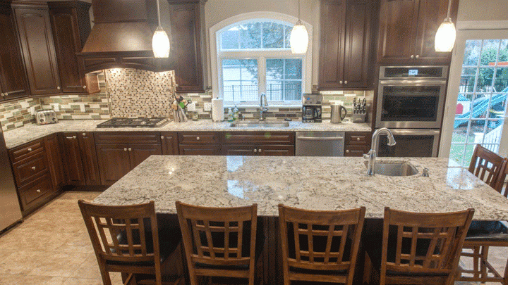 grey granite countertops with brown cabinets