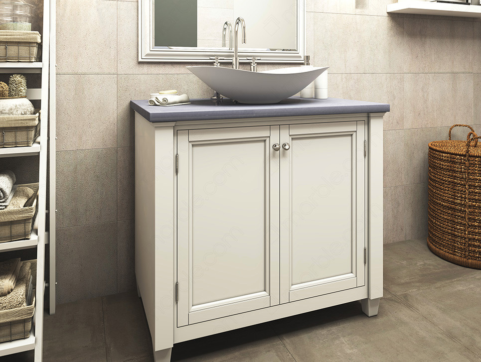 Bathroom has white cabinets white washbasin with blue quartz countertop 