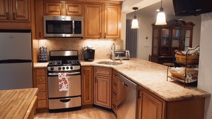 Photo of a beige kitchen with dark worktop on Craiyon