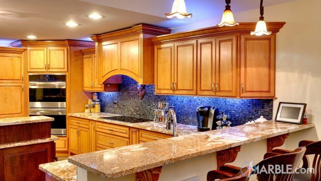 Juparana Patchwork Granite Countertop With A Unique Backsplash