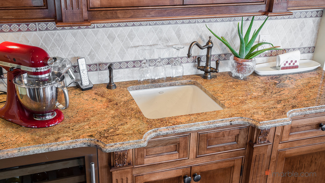 Madura Gold Kitchen Granite Countertops with Oak Cabinets | Marble.com